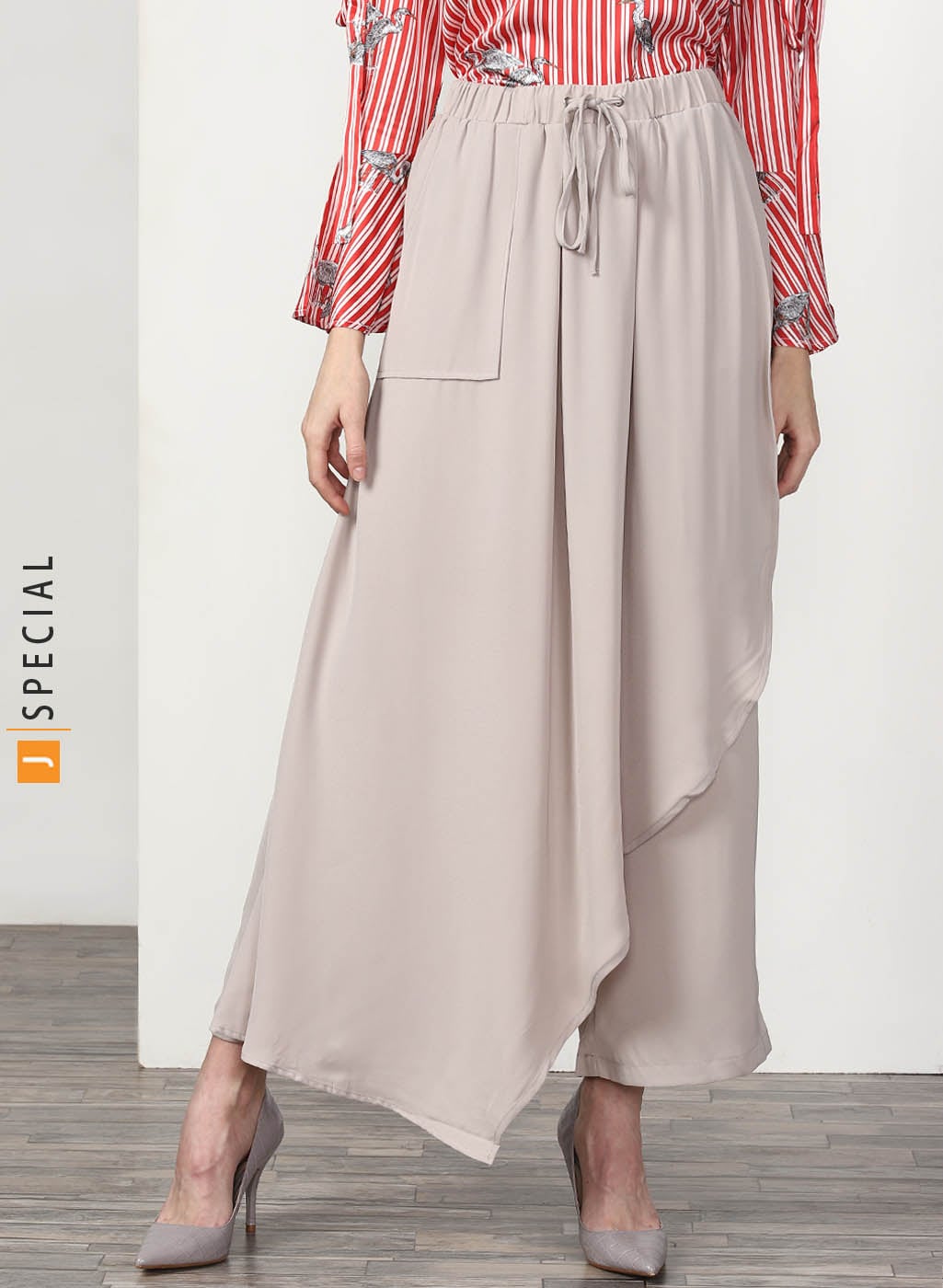 Wide Leg Pants Featuring Elasticated Waist Band With Tie-Up Detailing And A Uneven Layer At Front