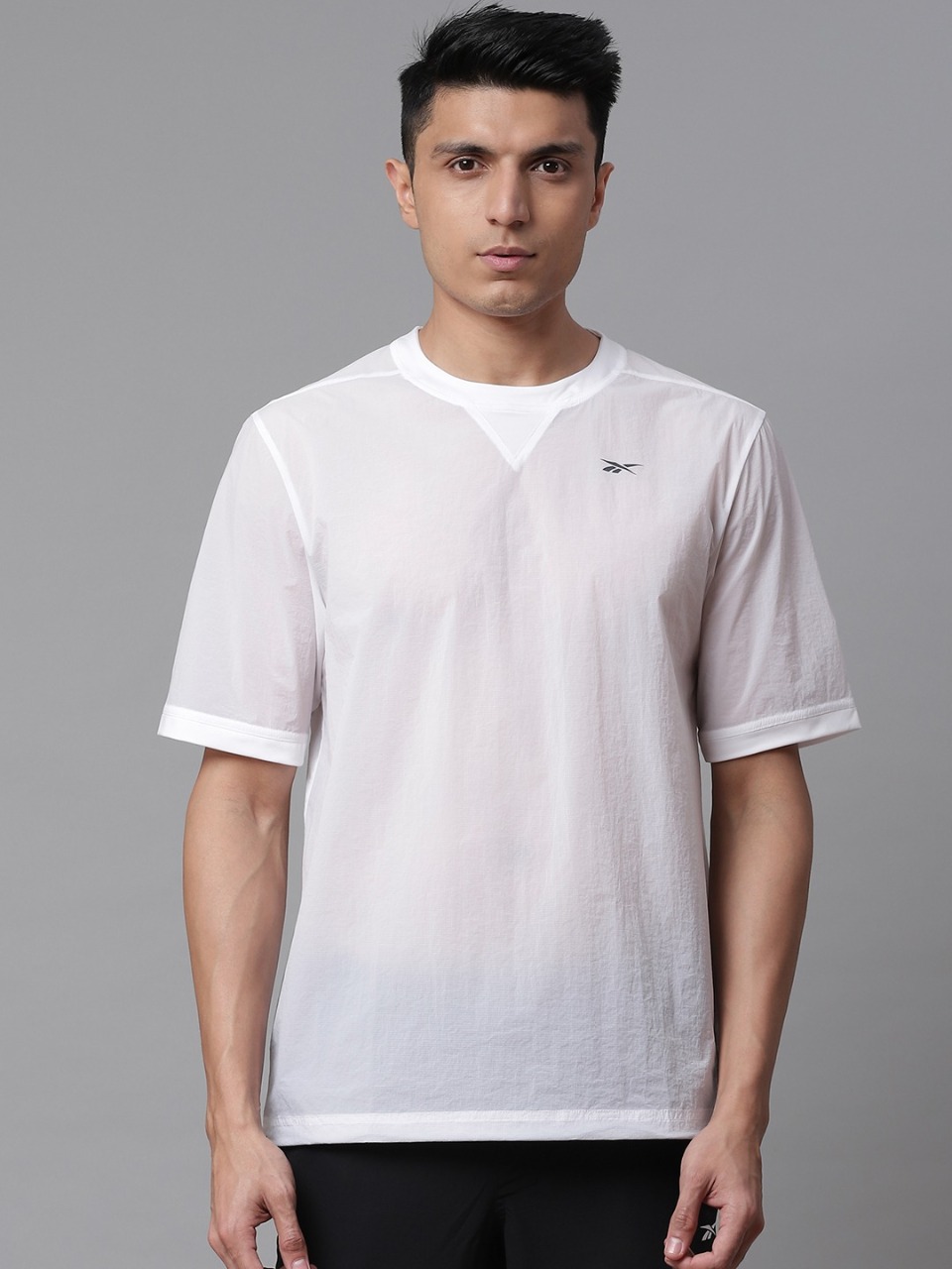 Reebok Men Solid Night Run T-shirt with Printed Detail at Back