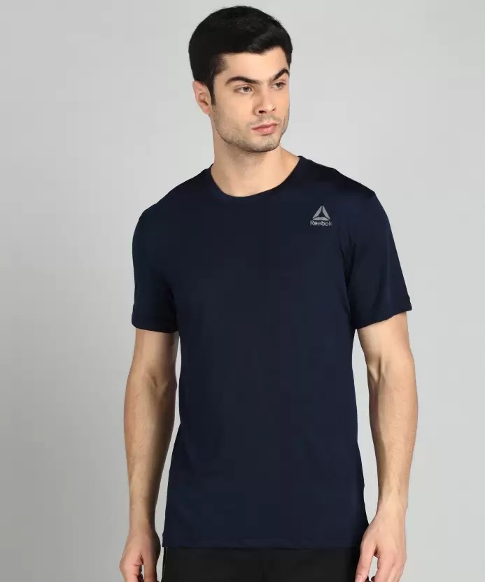 REEBOK  Solid Men Round Neck T-Shirt